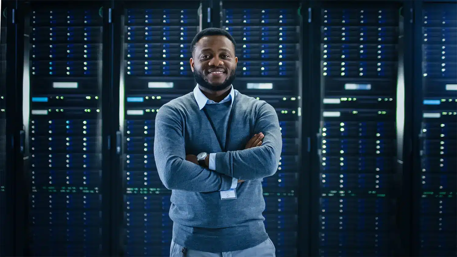 IT professional standing in a data center